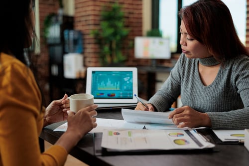 financial planner working with someone on alternative investments