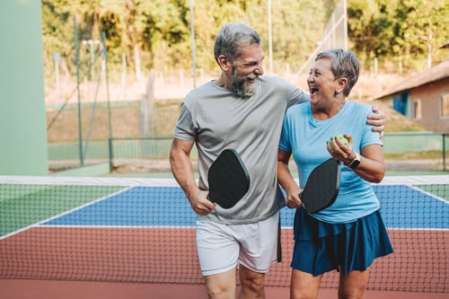  retired couple playing pickleball