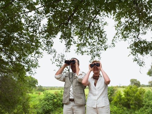 husband and wife with binoculars