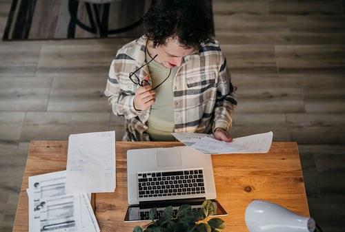 man looking at student loan paperwork