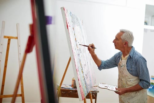 mature man painting