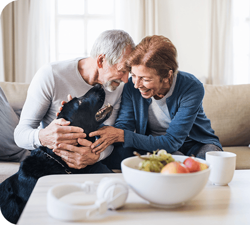 mature-couple-petting-dog-left