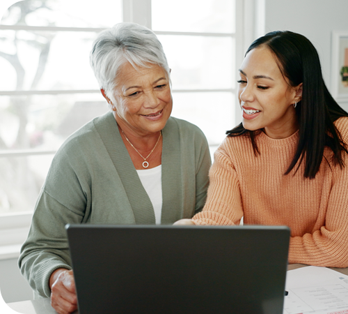 senior mom and daughter with tax review for retirement